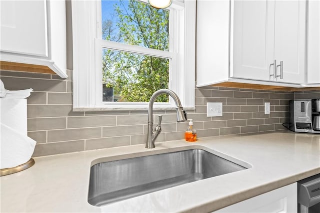 120 Columbia Heights Rd Unit 1, Charlestown, RI 02813 - details featuring a sink, backsplash, white cabinets, and light countertops