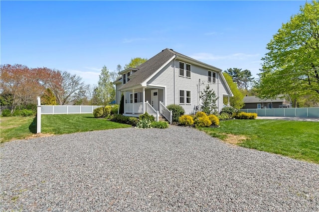 120 Columbia Heights Rd Unit 1, Charlestown, RI 02813 - view of front of house featuring fence, covered porch, and a front lawn