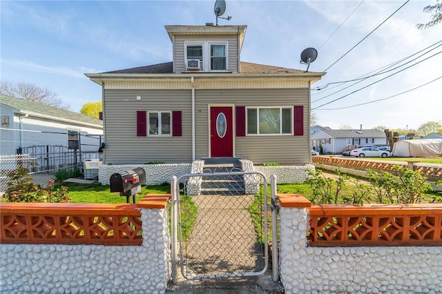 321 Columbus Ave, Pawtucket, RI 02861 - bungalow-style house with a gate, a fenced front yard, and roof with shingles