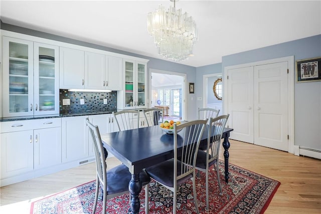 170 Summit Dr, Cranston, RI 02920 - dining area featuring light wood-type flooring, visible vents, and a notable chandelier