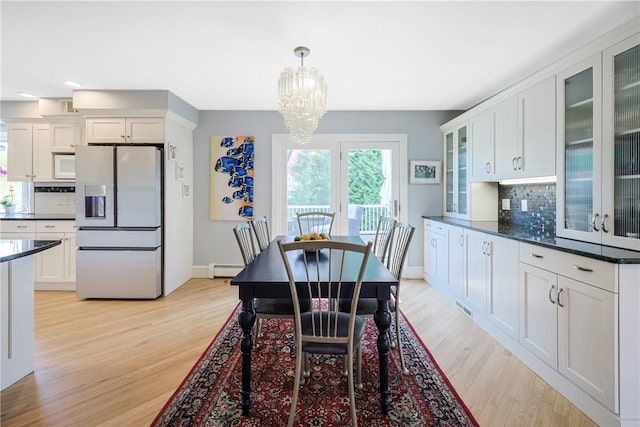 170 Summit Dr, Cranston, RI 02920 - dining area featuring a baseboard heating unit, a notable chandelier, light wood-style floors, and baseboards