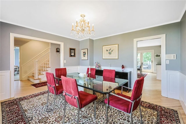 170 Summit Dr, Cranston, RI 02920 - dining area featuring stairs, light wood finished floors, a chandelier, and wainscoting