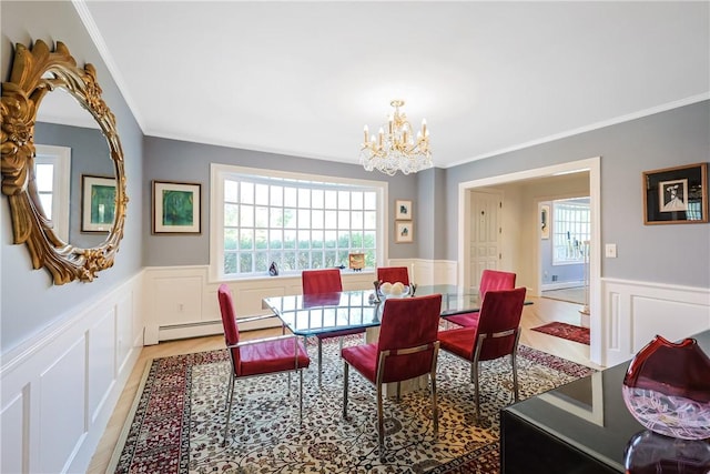 170 Summit Dr, Cranston, RI 02920 - dining space with a decorative wall, a baseboard heating unit, crown molding, wainscoting, and a notable chandelier