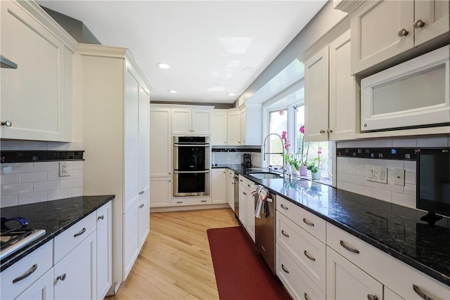 170 Summit Dr, Cranston, RI 02920 - kitchen featuring light wood-style flooring, a sink, stainless steel appliances, backsplash, and recessed lighting