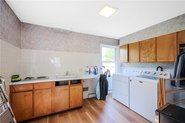170 Summit Dr, Cranston, RI 02920 - washroom featuring light wood finished floors, a sink, laundry area, washer and clothes dryer, and baseboard heating
