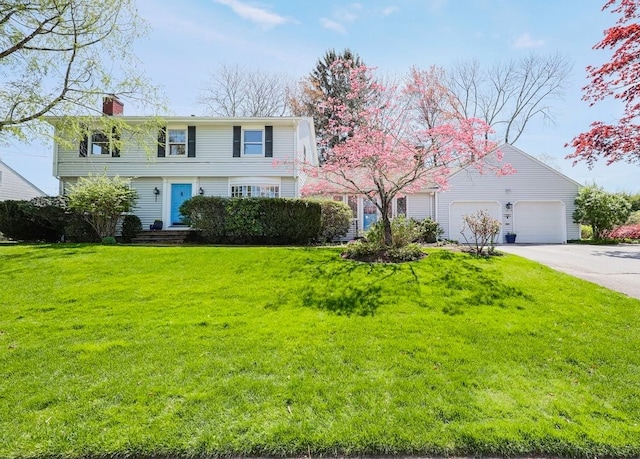 170 Summit Dr, Cranston, RI 02920 - colonial-style house with a chimney, a front yard, a garage, and concrete driveway