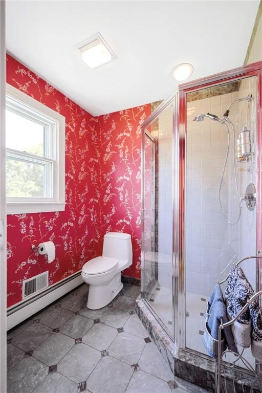170 Summit Dr, Cranston, RI 02920 - bathroom with a baseboard radiator, a shower stall, and toilet
