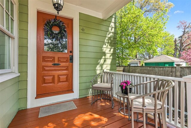 entrance to property with covered porch