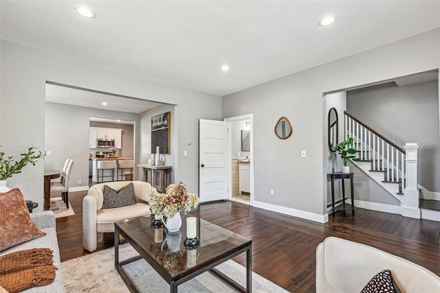 living room with stairs, recessed lighting, baseboards, and wood finished floors