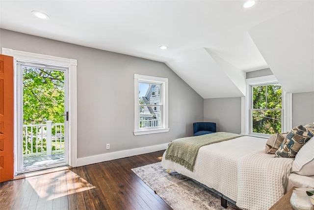 bedroom featuring access to outside, baseboards, dark wood finished floors, and multiple windows