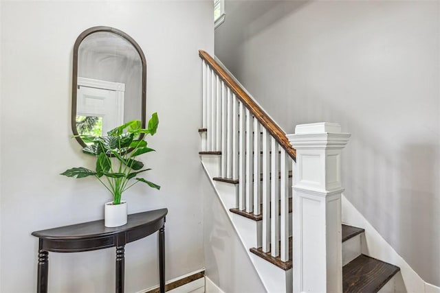stairs featuring baseboards