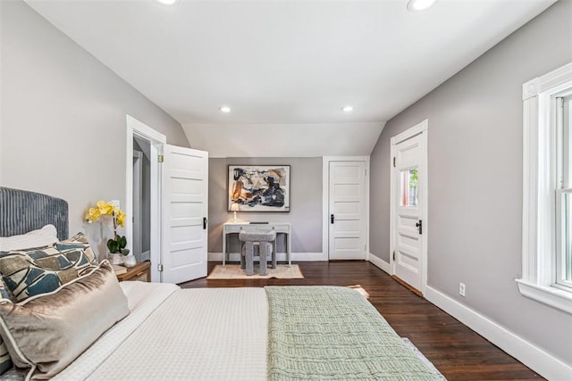 bedroom featuring recessed lighting, baseboards, multiple windows, and dark wood-type flooring