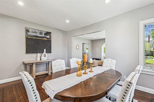 dining room featuring baseboards, recessed lighting, and wood finished floors