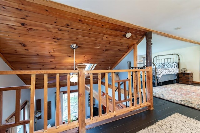 additional living space with vaulted ceiling, wood ceiling, and hardwood / wood-style floors