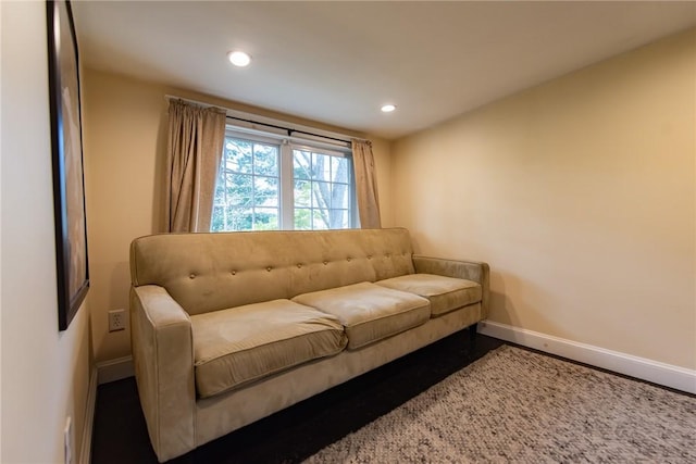 living area featuring recessed lighting, baseboards, and wood finished floors