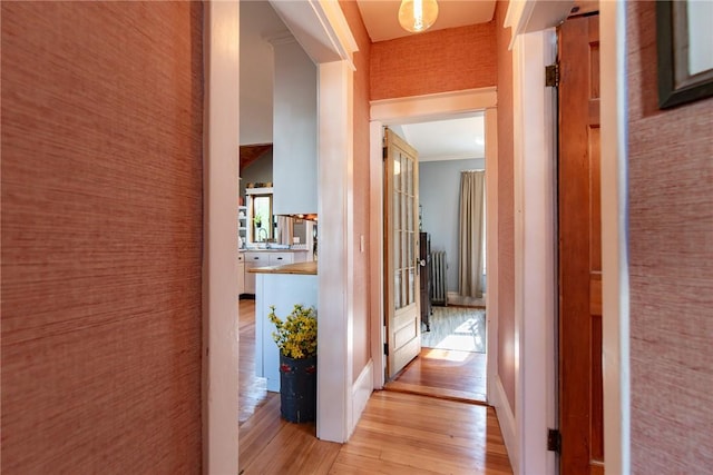 hallway featuring light wood-style flooring