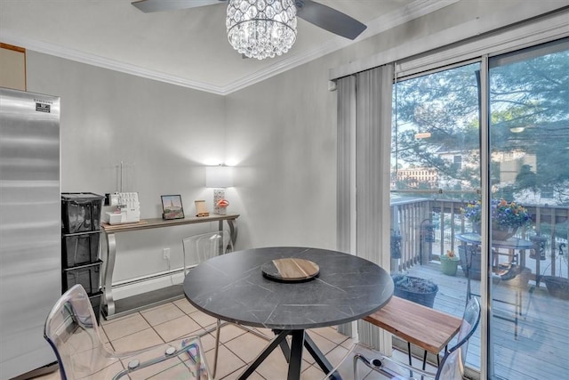 tiled dining room with ceiling fan and ornamental molding