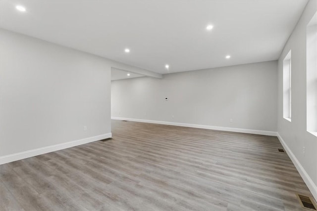 87 Dunedin St, Cranston, RI 02920 - spare room with baseboards, recessed lighting, wood finished floors, and visible vents