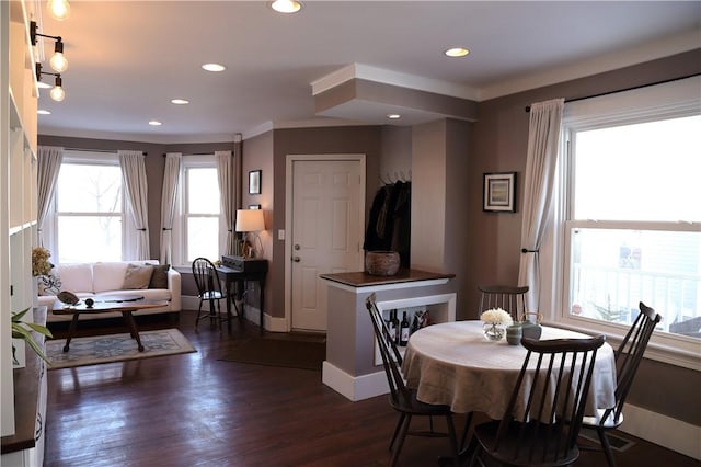 dining area with baseboards, dark wood-style flooring, and recessed lighting