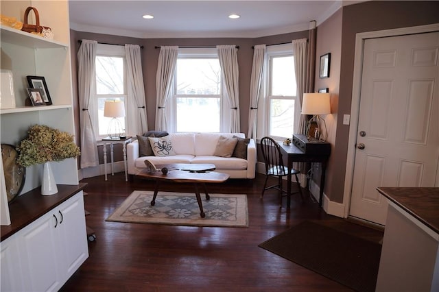living area featuring recessed lighting, a wealth of natural light, and dark wood-type flooring