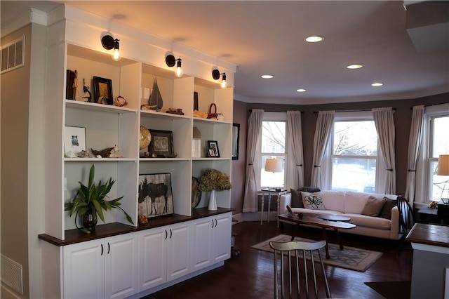 living area with recessed lighting, dark wood-style floors, and visible vents