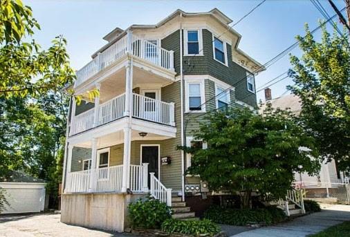 view of front of house featuring covered porch and a balcony
