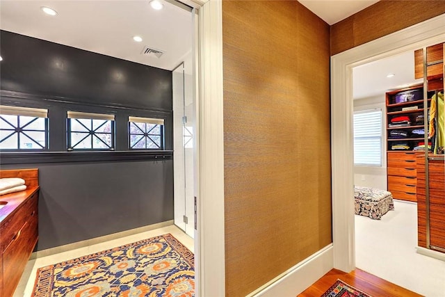 interior space featuring visible vents, recessed lighting, baseboards, and wood finished floors