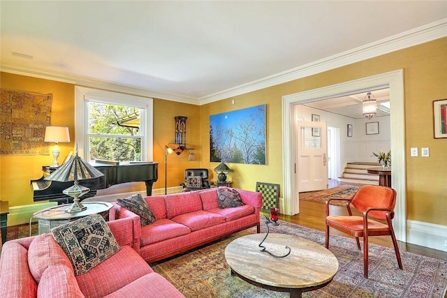 living area featuring ornamental molding, stairs, and wood finished floors