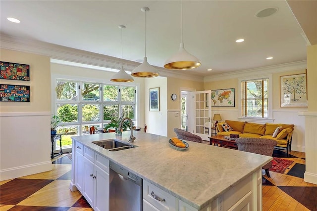 kitchen featuring ornamental molding, white cabinetry, a sink, light wood finished floors, and dishwasher