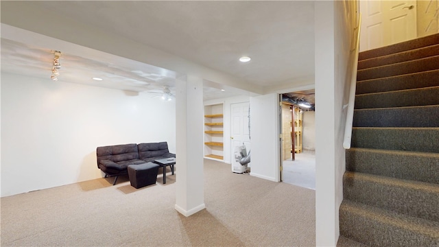 finished below grade area featuring stairway, carpet floors, baseboards, and recessed lighting