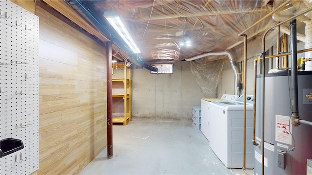 basement featuring independent washer and dryer and gas water heater