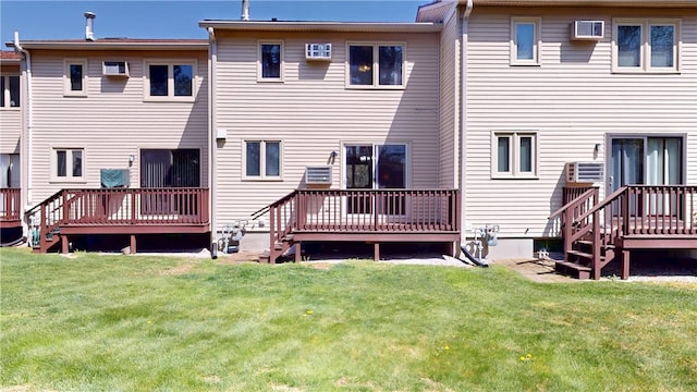 back of house featuring a yard and a deck