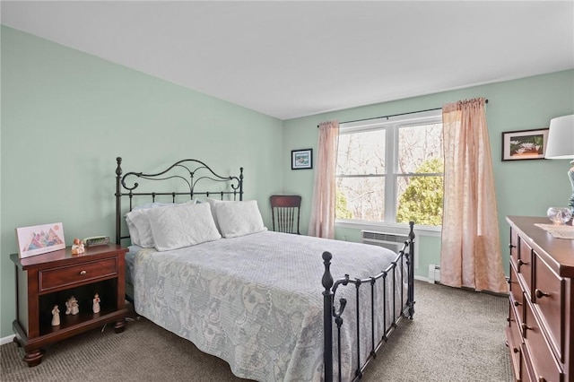 carpeted bedroom featuring baseboards and a baseboard heating unit