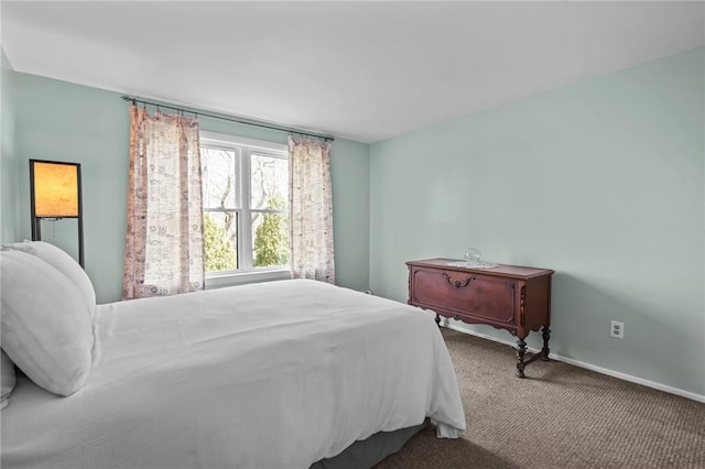 carpeted bedroom with baseboards