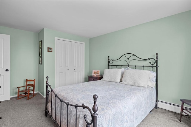 carpeted bedroom with baseboards, a baseboard radiator, and a closet