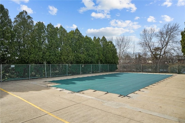 pool featuring a patio and fence