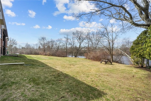 view of yard with a water view