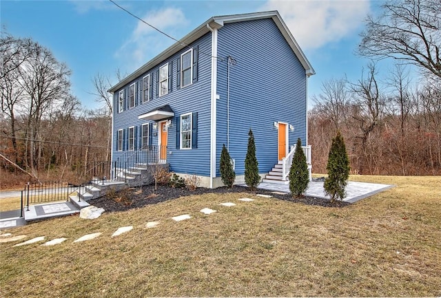 view of front of home with a front lawn