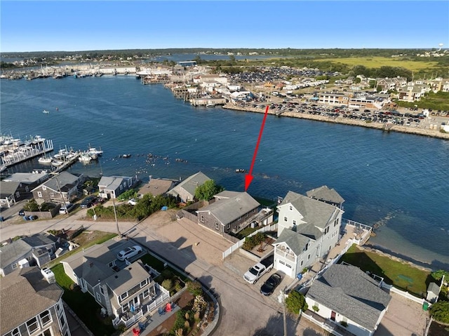 drone / aerial view featuring a water view and a residential view