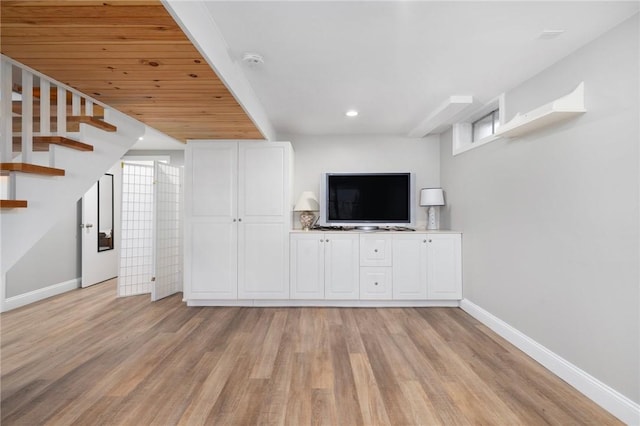 unfurnished living room with light wood-style floors, baseboards, and recessed lighting