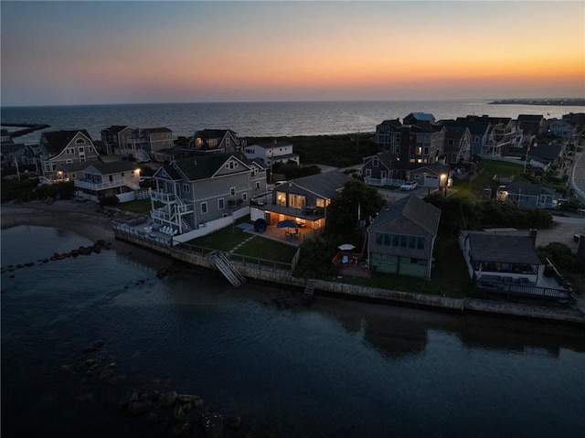 aerial view with a water view and a residential view