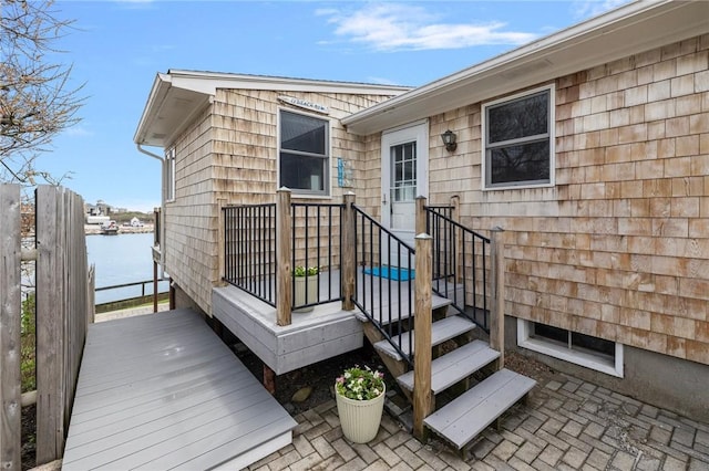 wooden deck featuring a water view