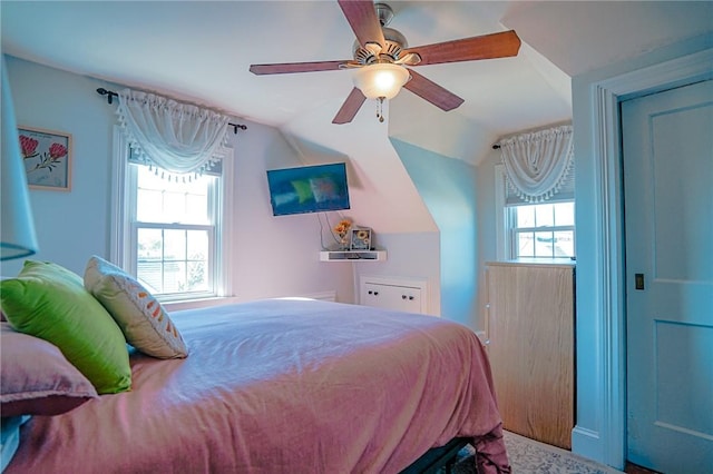 bedroom with ceiling fan and vaulted ceiling
