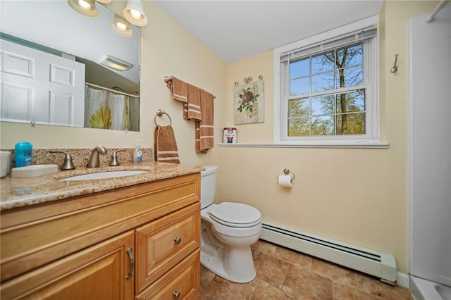 full bathroom featuring toilet, a baseboard heating unit, a shower with shower curtain, and vanity
