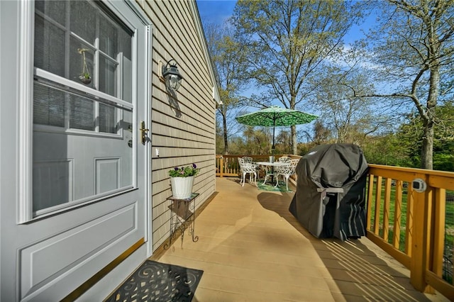 view of property exterior with outdoor dining space