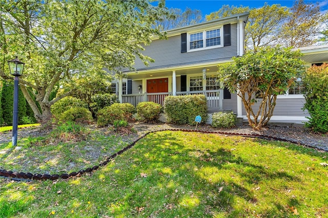 105 Quaker Dr, West Warwick, RI 02893 - traditional-style home featuring covered porch and a front yard