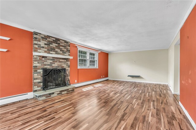 105 Quaker Dr, West Warwick, RI 02893 - unfurnished living room with a baseboard radiator, baseboards, a brick fireplace, crown molding, and wood finished floors