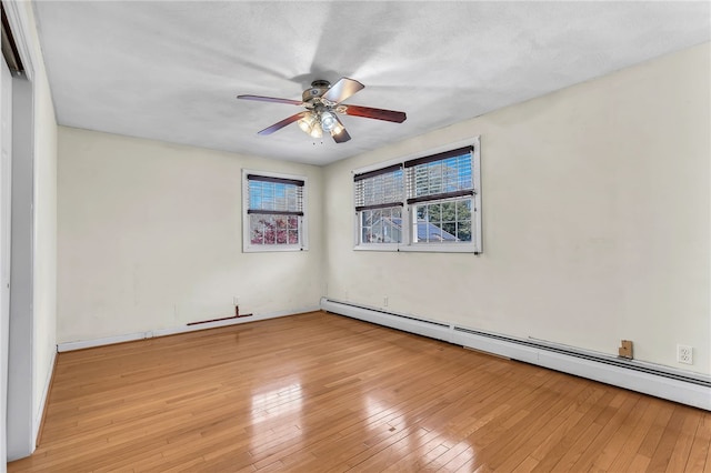 105 Quaker Dr, West Warwick, RI 02893 - unfurnished room with wood-type flooring, baseboards, a ceiling fan, and a baseboard heating unit