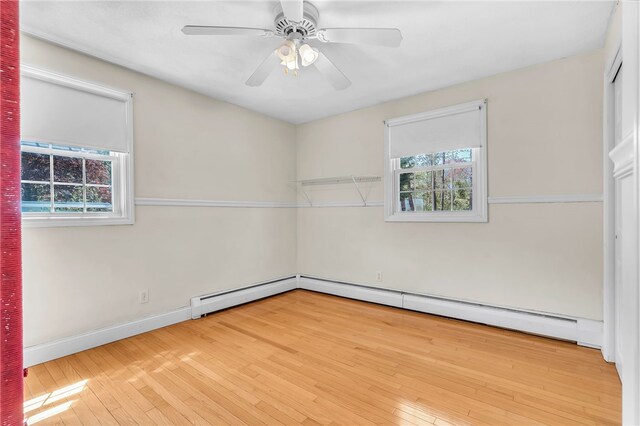 105 Quaker Dr, West Warwick, RI 02893 - spare room featuring a wealth of natural light, a ceiling fan, and hardwood / wood-style flooring
