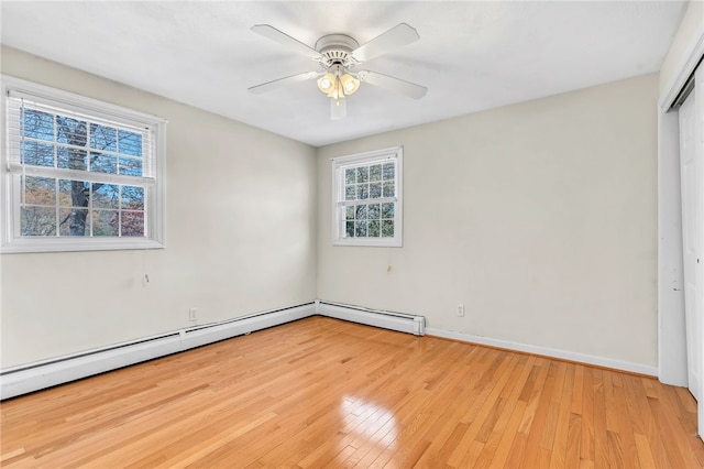 105 Quaker Dr, West Warwick, RI 02893 - unfurnished bedroom with light wood finished floors, a closet, baseboards, and a baseboard heating unit